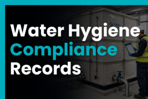 Technician reviewing digital water hygiene records beside a GRP cold water storage tank in a plant room.