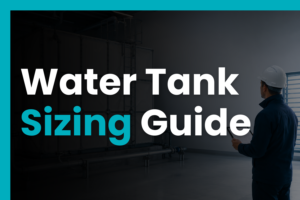 Engineer reviewing sizing calculations beside a GRP cold water storage tank in a plant room, representing cold water storage tank sizing, capacity planning, and UK design guidance.